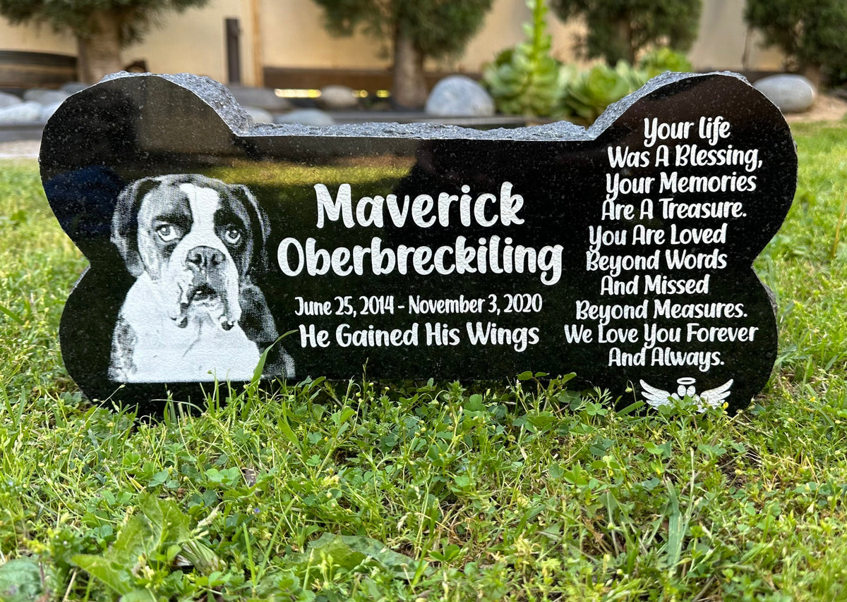 Engraved black granite pet memorial displayed outdoors