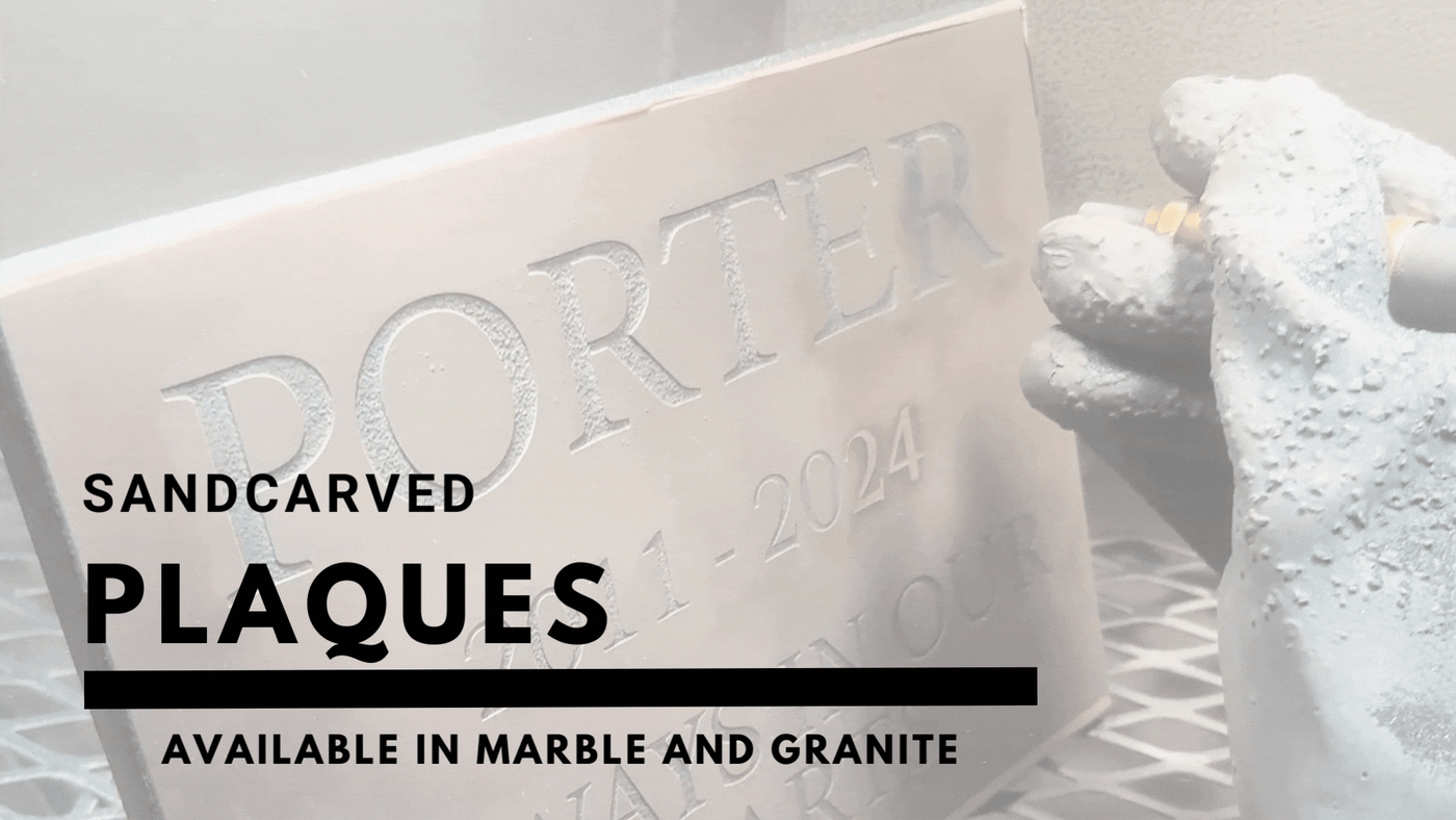 A pet memorial being deeply sand carved into stone
