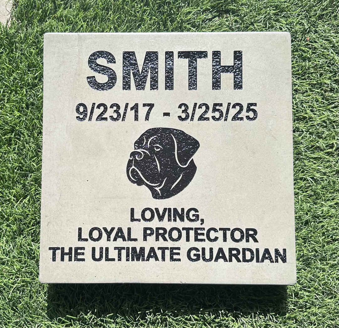 Memorial stone for a dog named Smith on grass