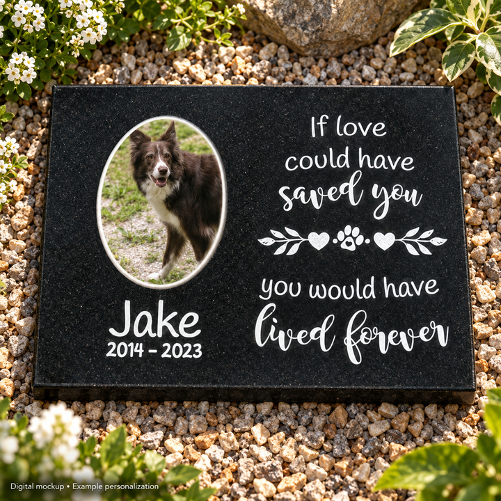 Digital lifestyle mockup of the If Love Could Have Saved You black granite memorial with an oval kiln-fired color pet portrait in a garden; example personalization.